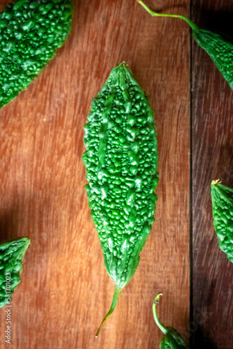 Wild bitter gourd on a wooden background.