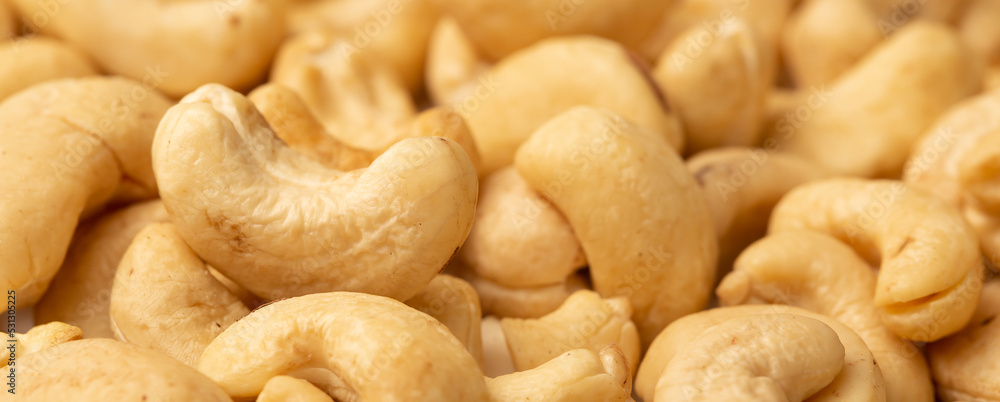 Cashew nuts as a background, top view. Cashew isolated on white background. Healthy foods. Cashew nuts as a background, top view. Cashew isolated on white background. Healthy foods.