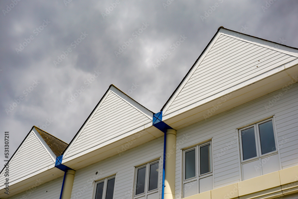 roof top of building and cloudy sky. roof top of building and cloudy sky.