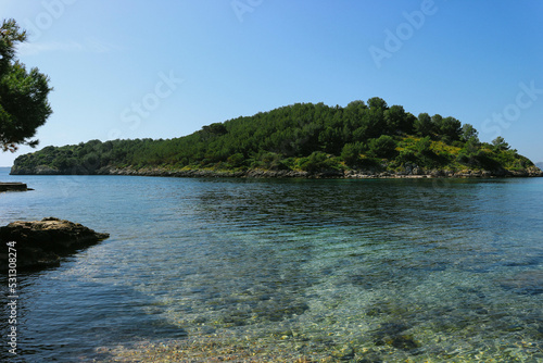 Beautiful turquoise mediterranean waters with mountains around in spanish island 