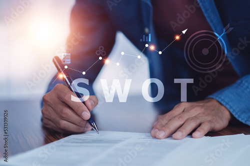 Fototapeta SWOT analysis concept, businessman drawing swot analysis strategy for business p