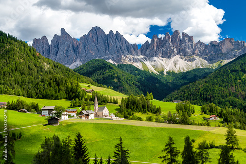 Saint Magdalena church of Villnöß (Funes) in South Tyrol in northern Italy with the iconic Gruppo delle Odle mountains of the Dolomite Alps in the background