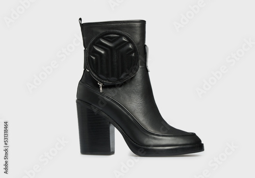 Black women's fashion leather high heel ankle boot isolated on white background. Female classic spring autumn shoe with small bag case. Blank casual classic footwear. Mock up, template