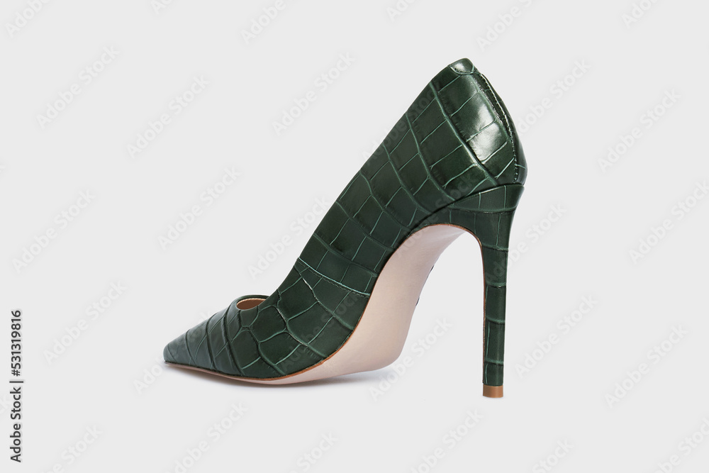 Obraz premium Emerald pointy toe women's shoes with high heels isolated on white background. Green Female classic stiletto heels in crocodile skin leather. Behind view. Mock up, template
