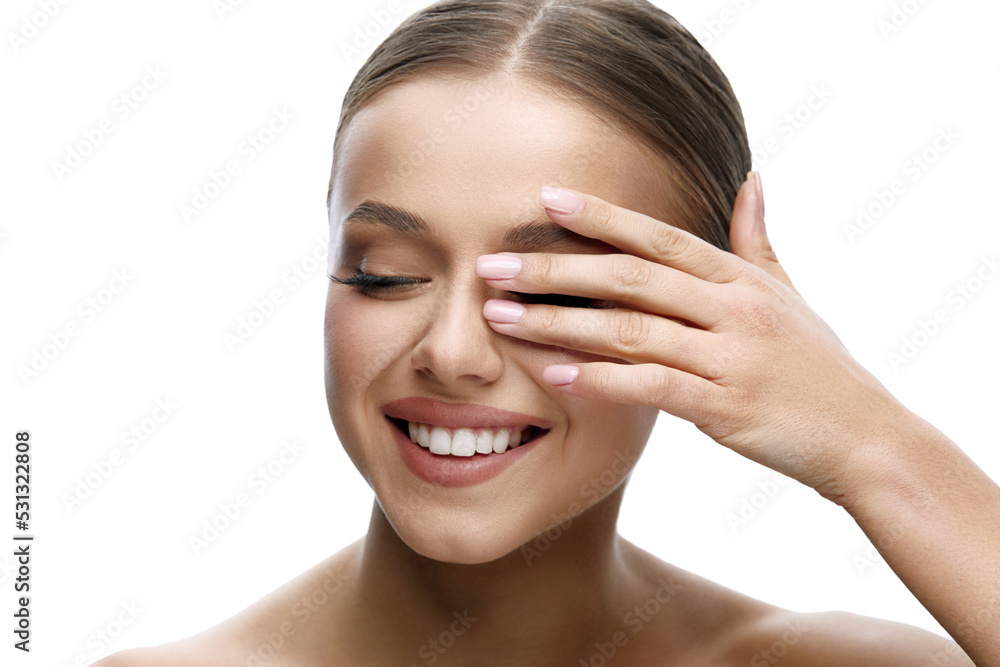 Beauty face. Beautiful girl model touching fresh glowing facial skin on white background closeup. Woman with natural makeup and healthy skin portrait. Skin care concept. Beauty face. Beautiful girl model touching fresh glowing facial skin on white background closeup. Woman with natural makeup and healthy skin portrait. Skin care concept.