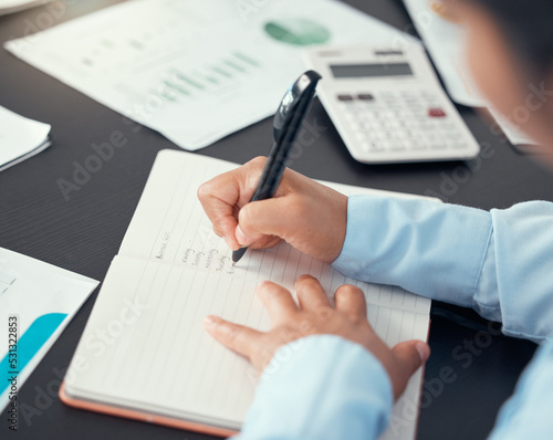 Business woman hand writing in notebook for KPI planning, financial report and company growth or data in meeting. Zoom on employee, worker and brand manager with paper documents and schedule