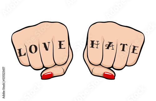 Female fist with Love Hate tattoo on fingers, front view of a woman fist with tattoo and polished nails
