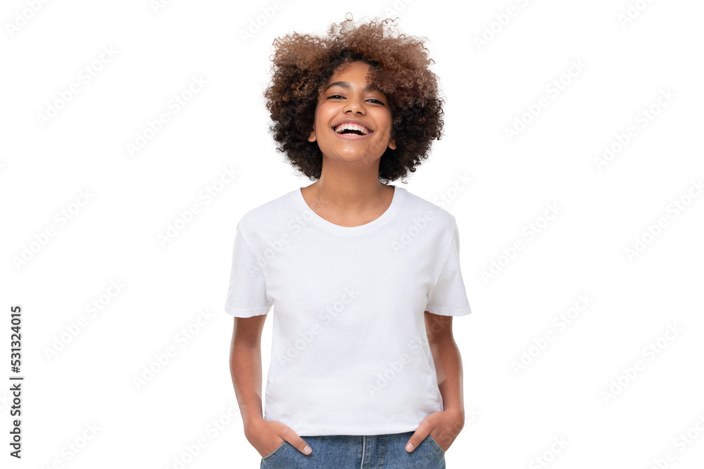© Damir Khabirov - Front view of laughing african teen girl standing with hands in pockets, wearing white tshirt with copy space