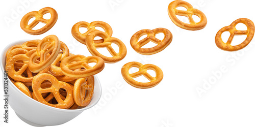 Fotografia Falling salted pretzels in bowl isolated