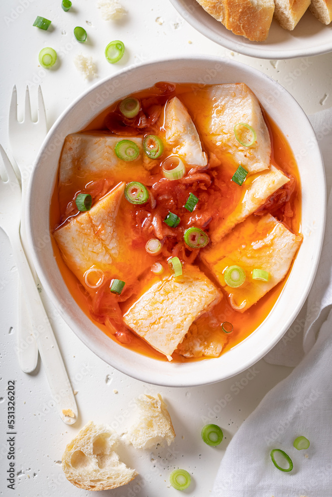 Healthy and tasty marinated herring with tomato sauce and chive - obrazy, fototapety, plakaty 