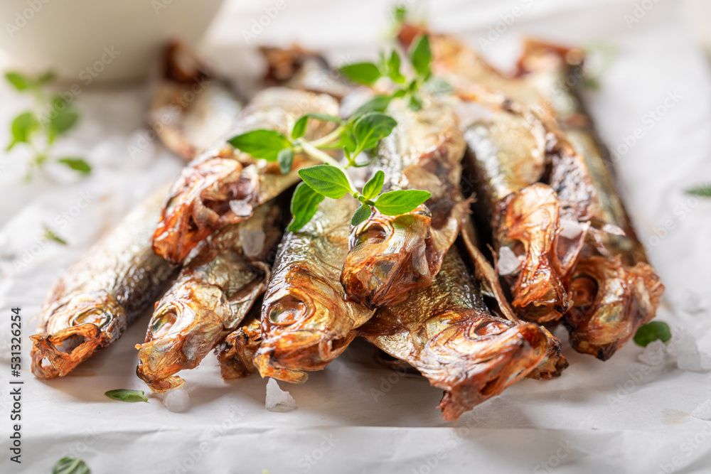 Salty smoked sprats as a healthy snack. Salty smoked sprats as a healthy snack.