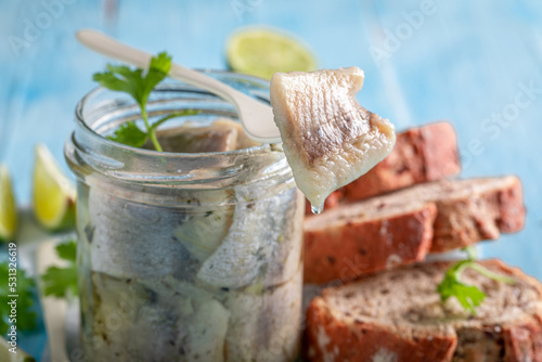 Tasty and healthy pickled fish with onion and herbs.