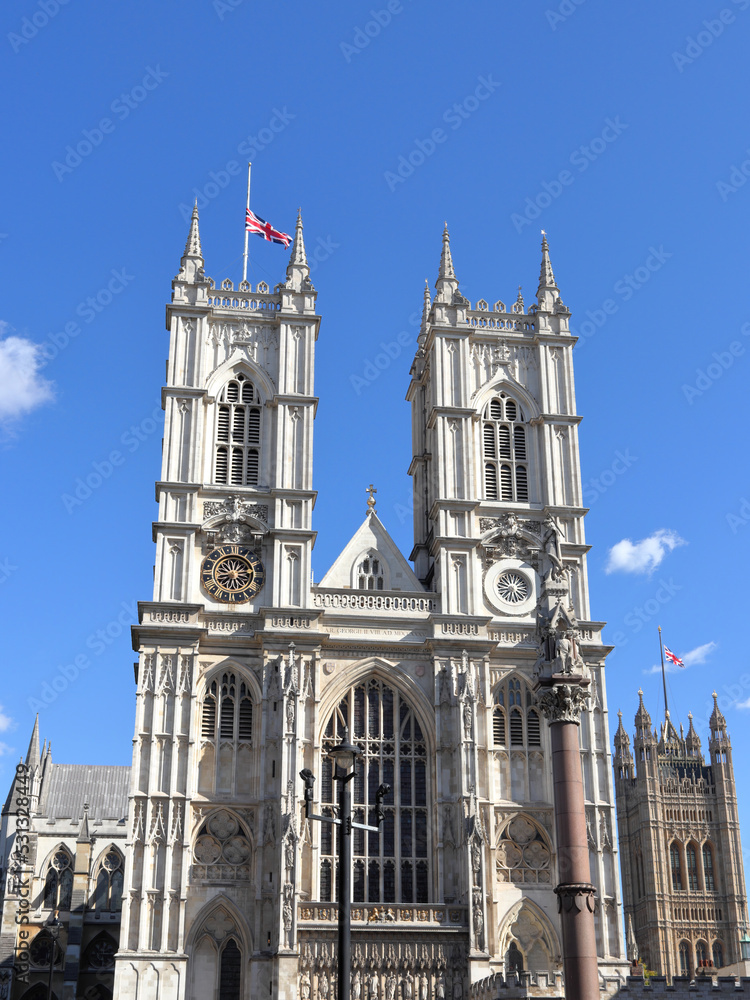 Obraz premium The Union Flag flying half-mast on the Westminster Abbey and Victoria Tower in London, UK
