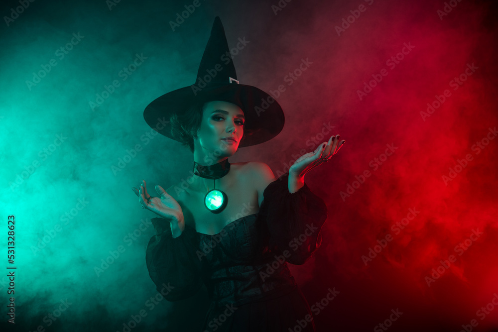 Photo of stunning fear lady maleficent fiction personage do spells with gemstone amulet isolated fog colorful background