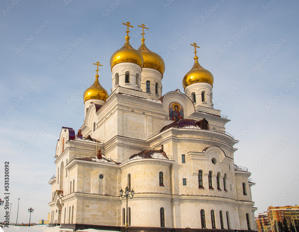 Orthodox church in the city of Arkhangelsk on a frosty day against a blue sky