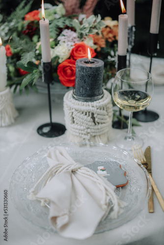 Modern wedding table decorated with plates, cutlery and flowers © nerudol