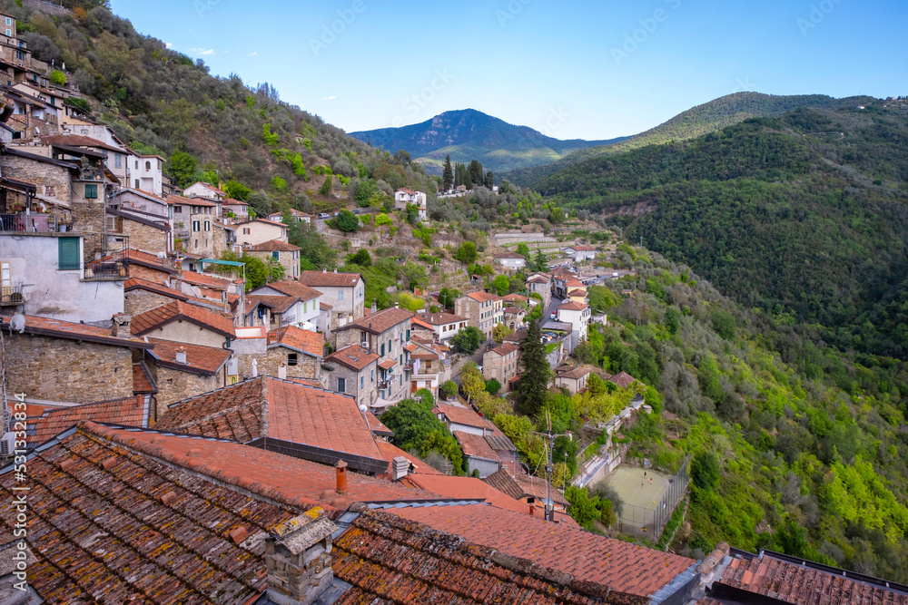 Summer panorama of Apricale, a small ancient village of stone-made houses above the Ligurian Alps (Northern Italy), close to the borders between Italy and France.