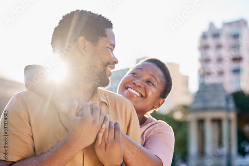 Sun, flare and love for couple happy on outdoor romantic date to bond, relax and enjoy fun time together. Black woman and man with peace, hug and freedom while travel in Rome for holiday adventure