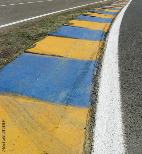 racetrack curb yellow and blue 