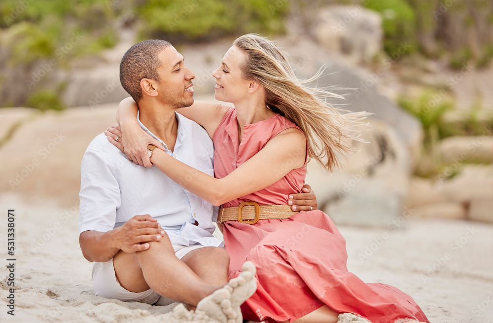 Love, hug and couple on the beach look into eyes and relax outdoor together on sand or ground. Happy interracial black man and woman enjoy summer holiday in nature for valentines day or anniversary Love, hug and couple on the beach look into eyes and relax outdoor together on sand or ground. Happy interracial black man and woman enjoy summer holiday in nature for valentines day or anniversary