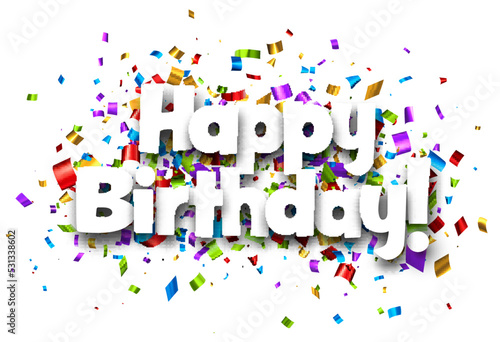 Happy birthday sign on colorful confetti background.