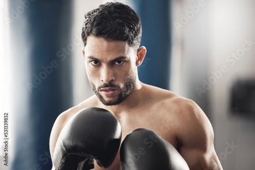 Mindset, fitness or sports boxer man with workout, training and exercise for health and wellness in gym. Sport, fight and athlete or personal trainer with motivation, vision and hands ready for event