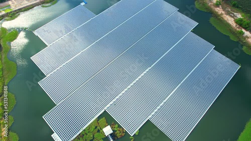 Floating solar panels and cell platform on the pond. Innovation of renewable clean energy for the environment. Renewable electric energy industry. aerial view from drone. 4k
 photo