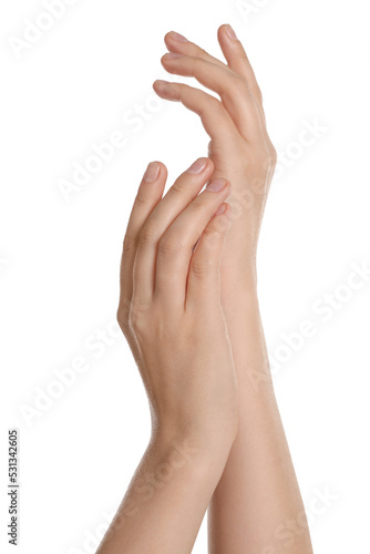 Woman applying cream on hand against white background  closeup