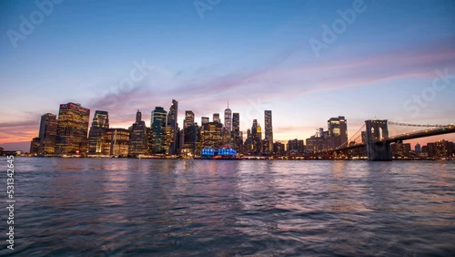 A 4K dusk to night timelapse of the New York City skyline, taken from Brooklyn across the East River from Manhattan. 