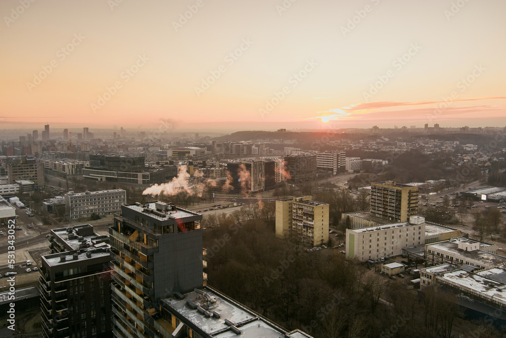 Scenic Vilnius city panorama in winter, Zirmunai district of a town. Aerial sunset view. Winter city scenery in Lithuania.