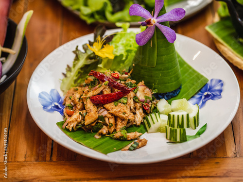 Spicy chicken salad with fresh vegetable, selective focus. Thai food concetp.