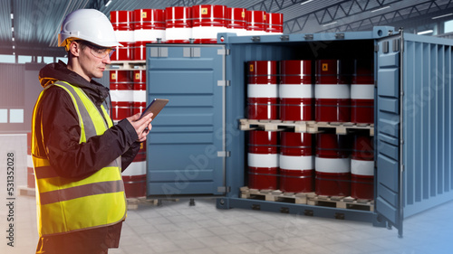 Oil logistics. Man with tab...