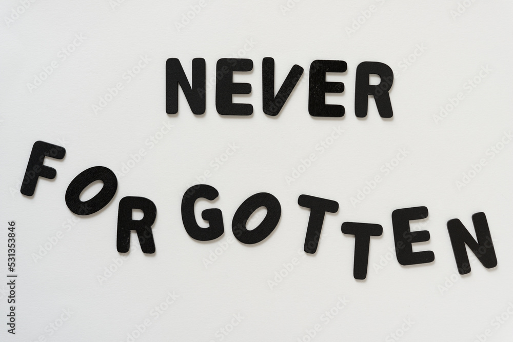 never forgotten (jumbled letters) - black chalk letters never forgotten (jumbled letters) - black chalk letters