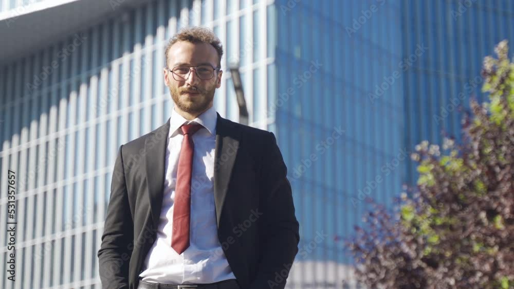 Business man looking at camera and smiling.
Confident businessman in suit looking at camera and smiling in front of luxury building.
Business man looking at camera and smiling.
Confident businessman in suit looking at camera and smiling in front of luxury building.