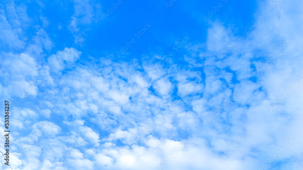 Bright clear blue sky. Various kind of clouds. Cirrocumulus clouds. Bright clear blue sky. Various kind of clouds. Cirrocumulus clouds.