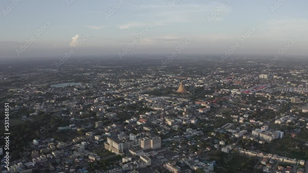Aerial view with a drone of Phra Pathom Chedi Nakhon Pathom Province in the middle of the city at the morning sunrise time.