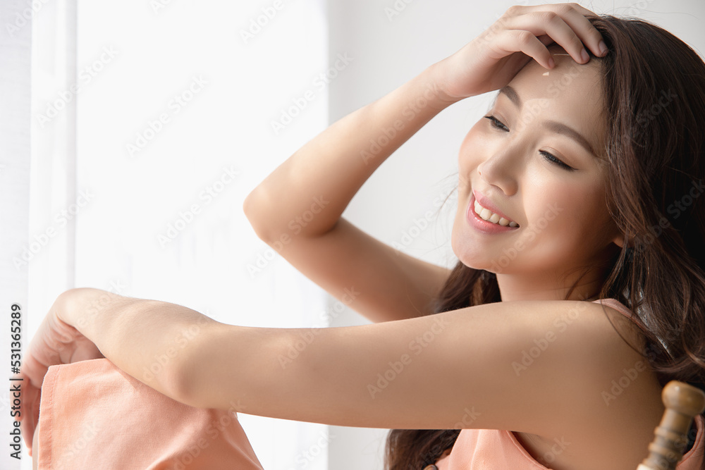 Portrait happy young asian woman clean fresh bare skin concept. Asian girl sitting modern wicker chair near window beauty face skincare and health wellness, Facial treatment, Perfect skin. Portrait happy young asian woman clean fresh bare skin concept. Asian girl sitting modern wicker chair near window beauty face skincare and health wellness, Facial treatment, Perfect skin.