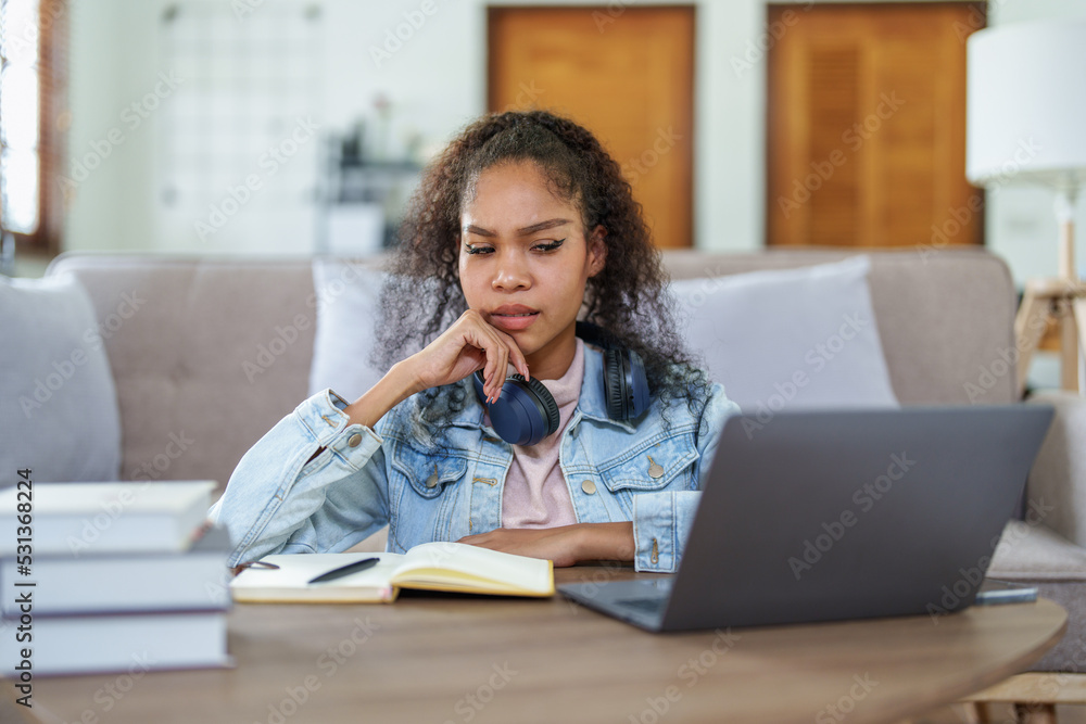 African American using computers and notebooks online African American using computers and notebooks online