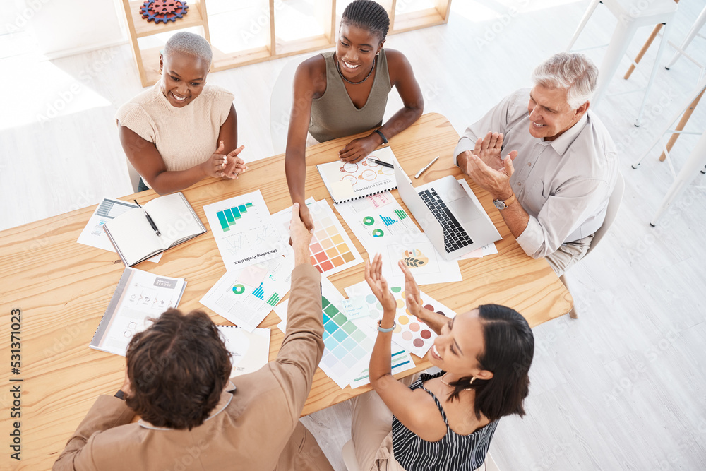 Obraz premium Handshake, welcome and thank you with business people shaking hands and their team in celebration with applause. Teamwork, b2b and achievement with a work group reaching an agreement, deal or goal