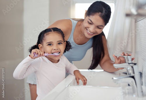 Принти на полотні Brushing teeth, girl or mother teaching learning child personal hygiene, dental care or healthcare in house or family home bathroom