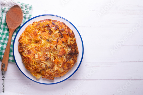 Potato and sweet potato omelette. Modern Spanish recipe of the traditional tortilla tapa.