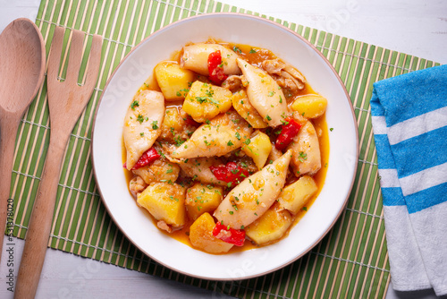 Squid stew with red peppers. Typical Spanish tapa recipe.