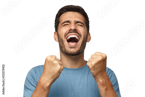 Tablou canvas Young man shouting with closed eyes, celebrating victory, squeezing fists in dee