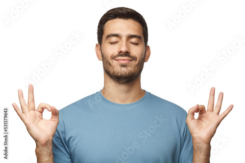 Canvas Print Happy smiling man standing with closed eyes, having relaxation while meditating
