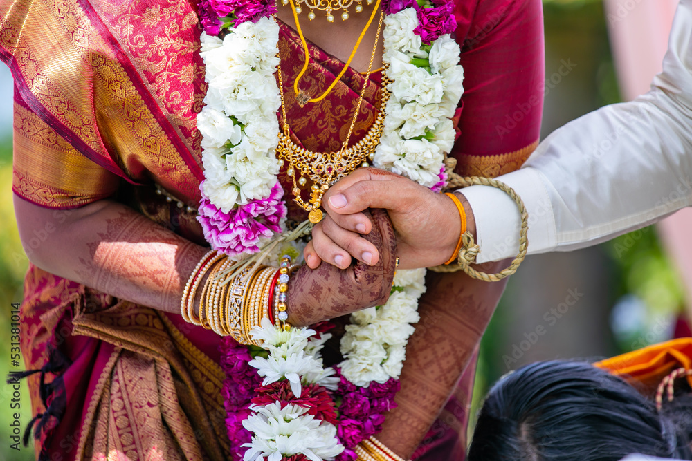 South Indian Tamil couple's holding hands close up