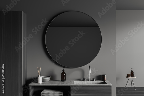 Grey bathroom interior with sink and mirror  accessories on deck