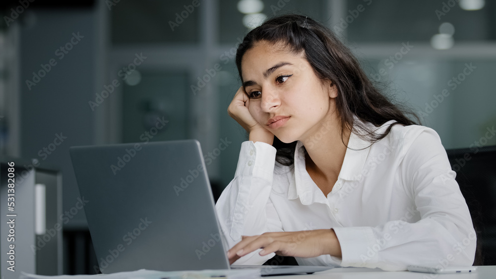 Bored sad lazy young indian woman manager sitting in office unmotivated uninterested in boring laptop work overworked tired sleepy businesswoman feeling tiredness experiencing lassitude exhausted work Bored sad lazy young indian woman manager sitting in office unmotivated uninterested in boring laptop work overworked tired sleepy businesswoman feeling tiredness experiencing lassitude exhausted work