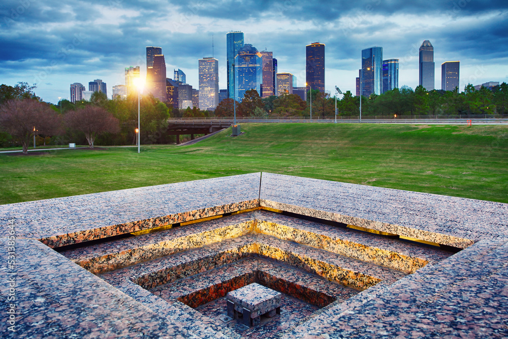 Downtown Houston from Police Memorial park at dramatic sunset. Green