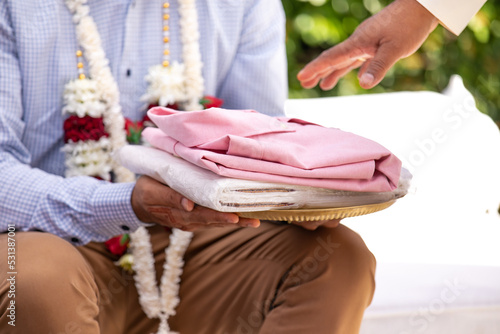 South Indian Tamil wedding ceremony ritual items and hands close up