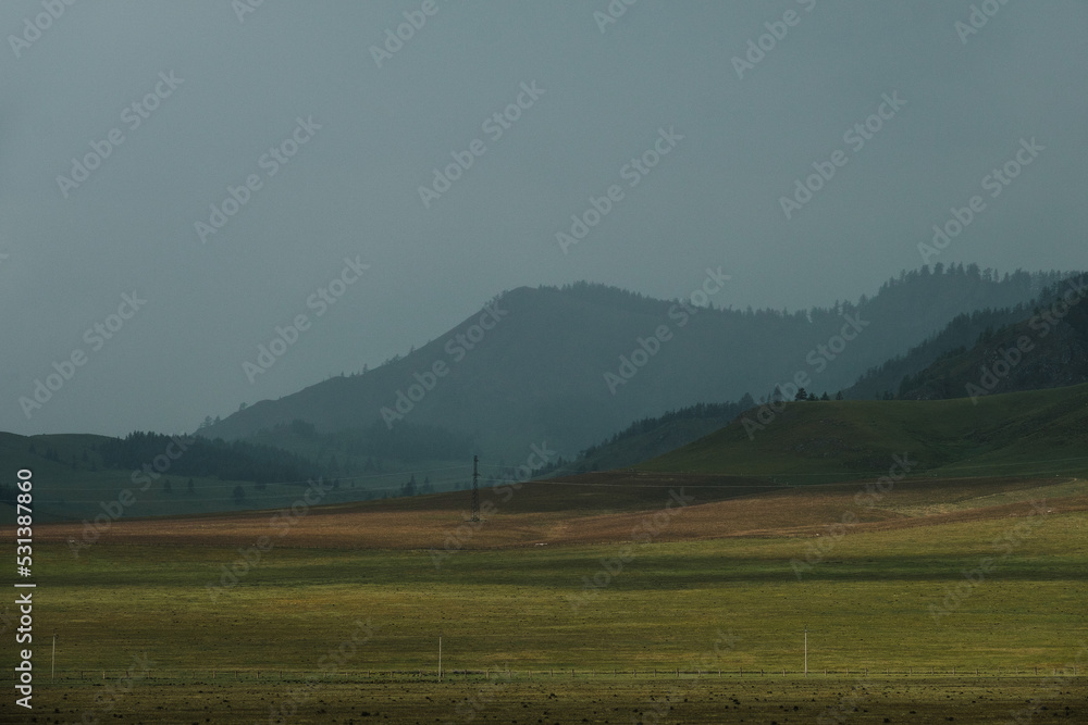 Green fields and slopes of the Altai Mountains Green fields and slopes of the Altai Mountains